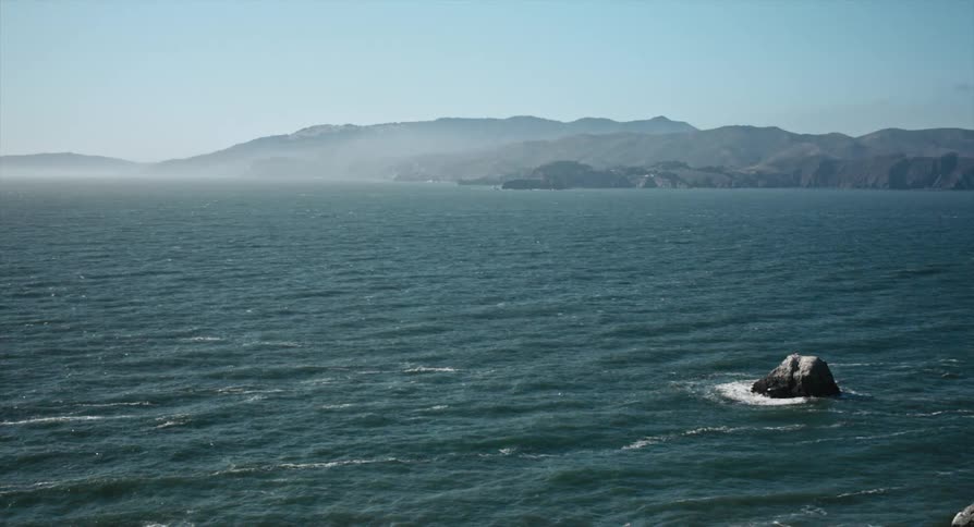 Waves are moving in the ocean at midday