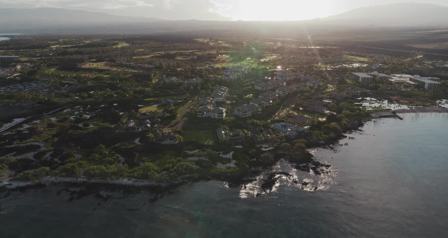 Aerial view of small coastal town at sunset