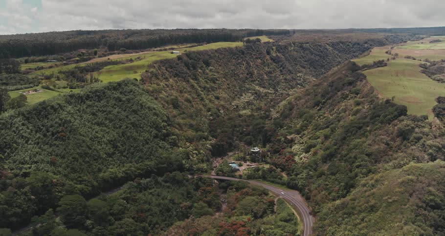 Aerial view of valley with a bend road