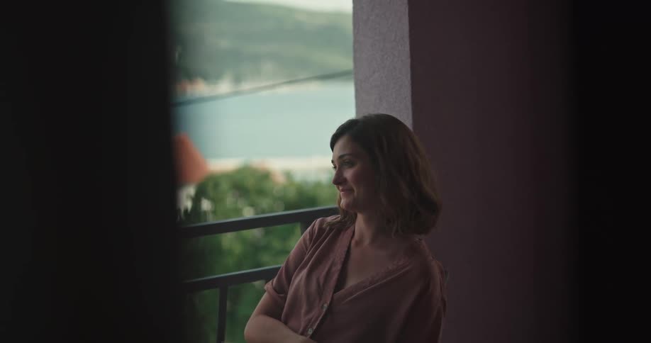 A woman sitting and reading while talking