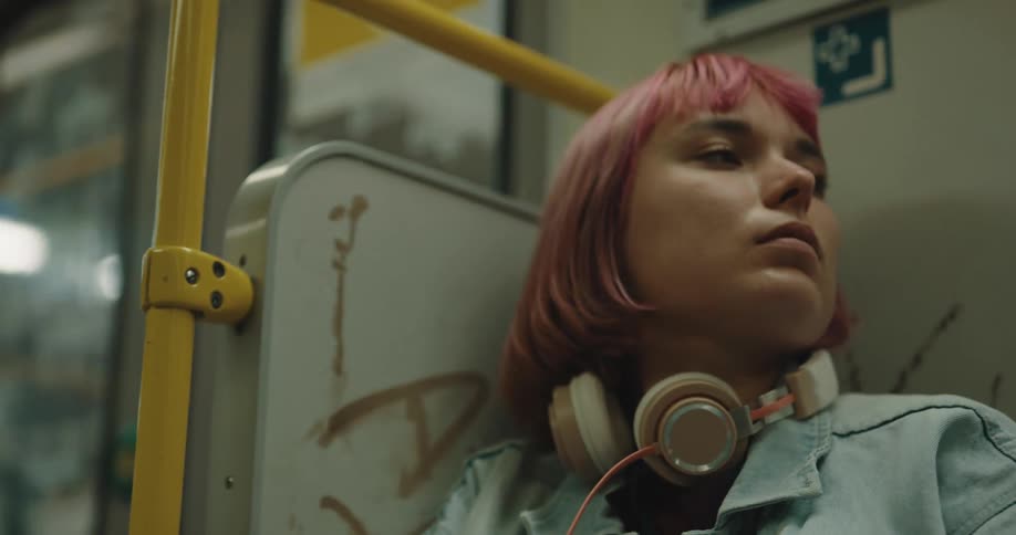 A woman sleeping on a train