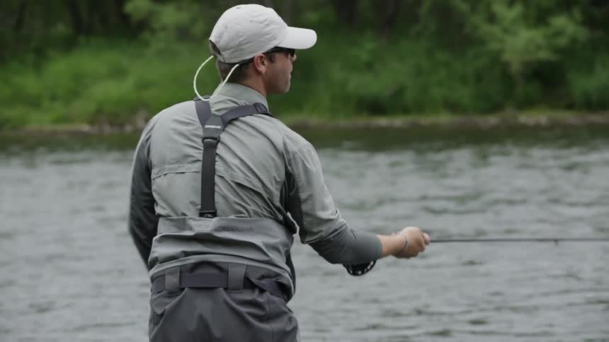A man fishes in a river