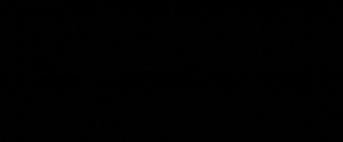Lightning is flashing and streaking at night creating a silhouette of a telephone pole