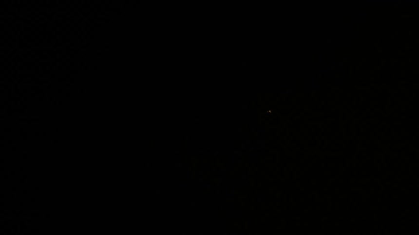 Light flares in pitch black illuminating thick fog