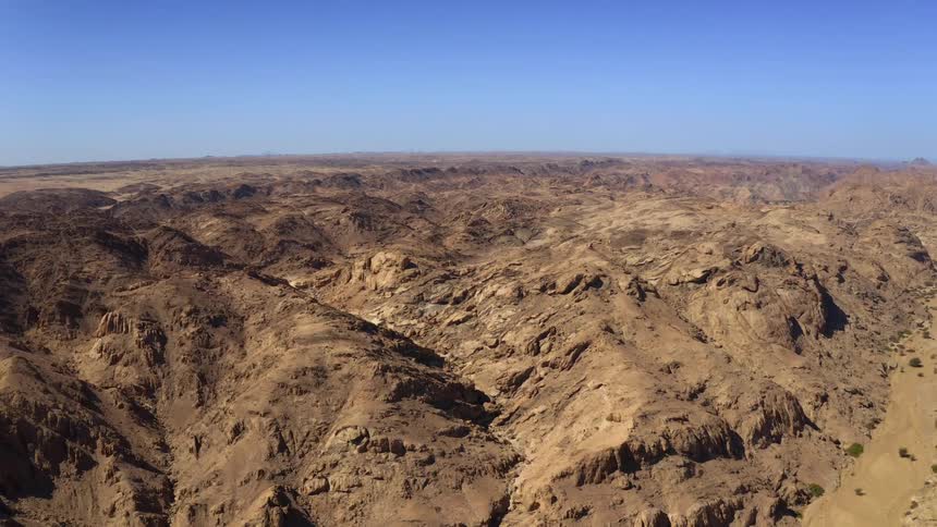 Mountainous desert under a clear blue sky
