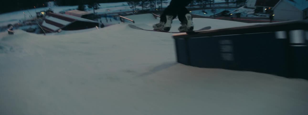 A man snowboarding outdoors