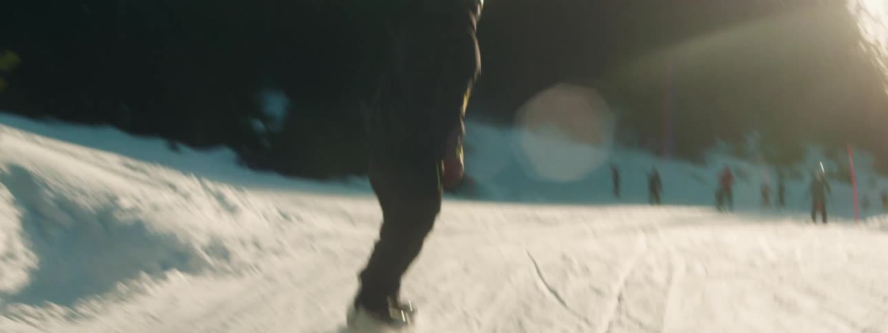 A man snowboarding down a mountain