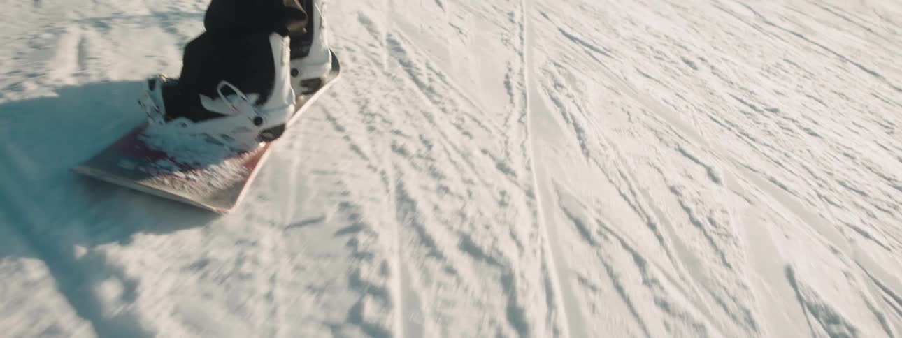 A man snowboarding outdoors