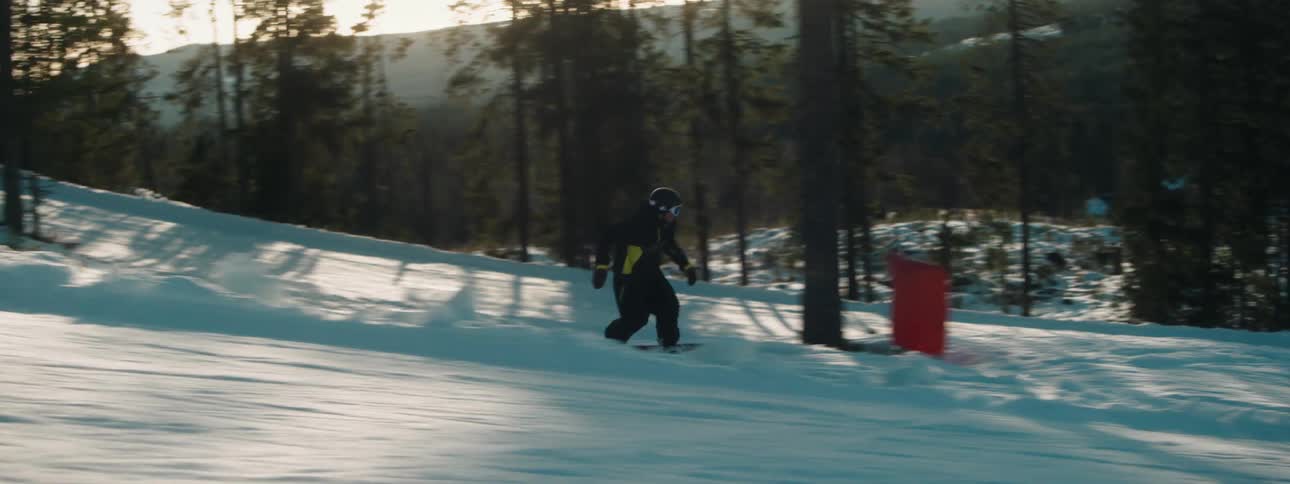 A man snowboarding outdoors