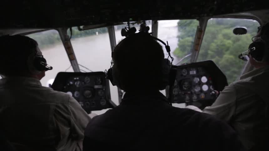 Three people taking off in a small airplane