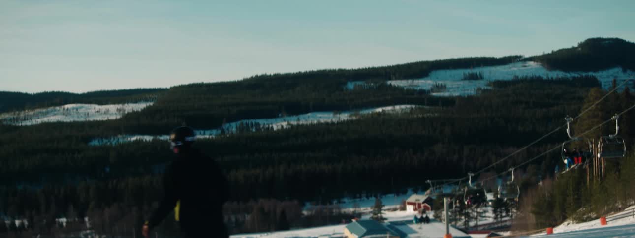 A man snowboarding outdoors