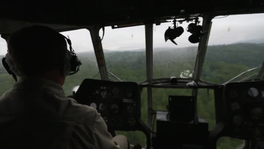 A man is steering an aircraft