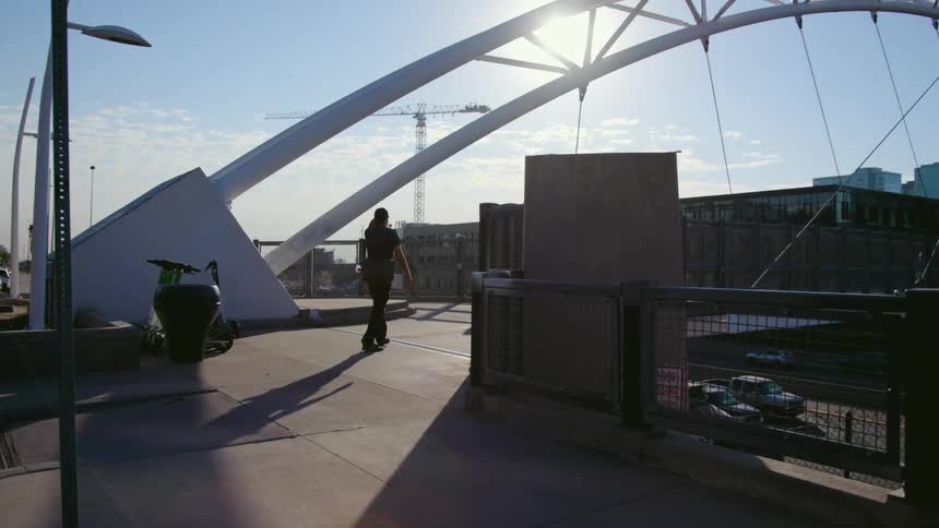 Person walking across bridge