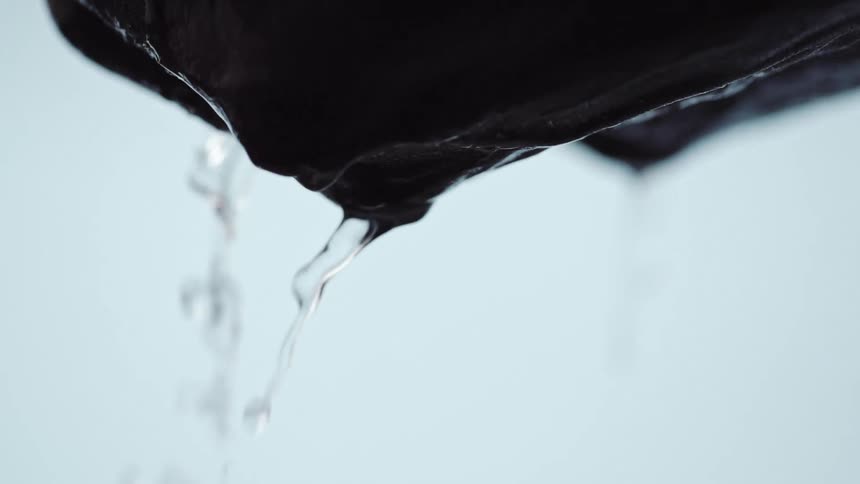 Close up of mans hands dropping water
