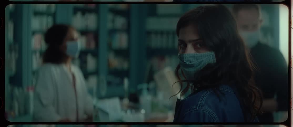 Two people shopping at a pharmacy