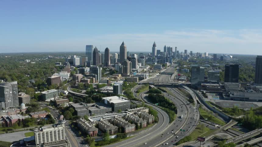 An aerial view of a city with tall buildings