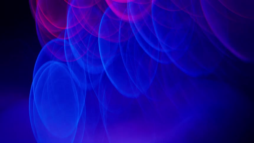 Lights forming blue and red circles rising in to the air