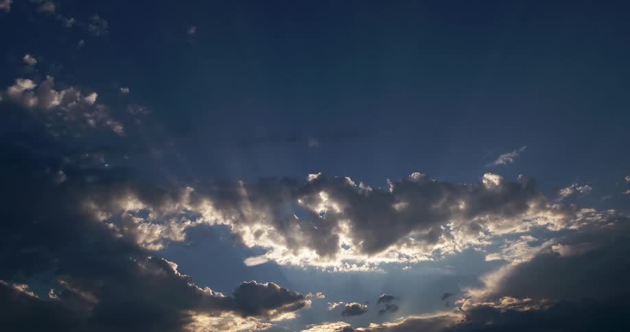 Gray clouds float in the blue sky