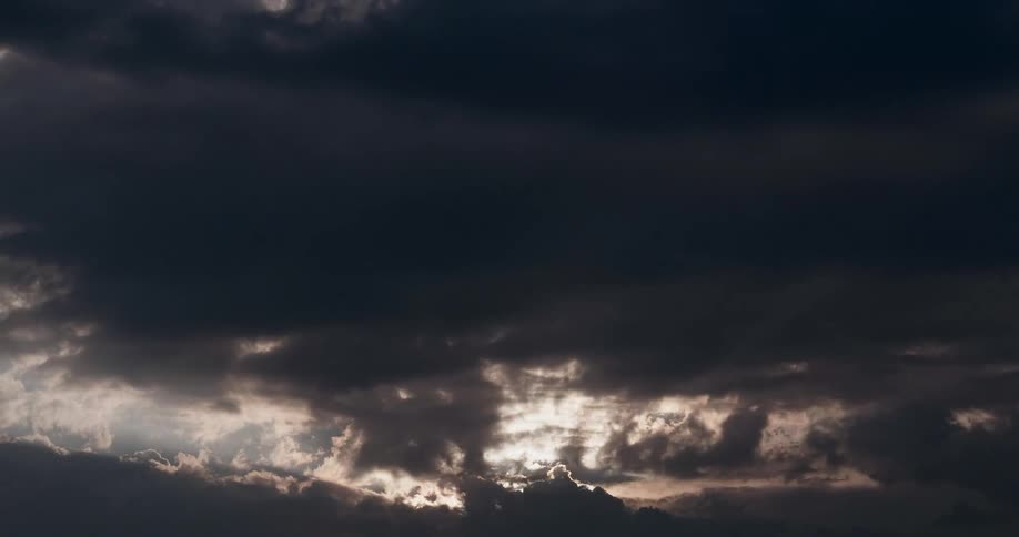 Dark clouds flow and gather eliminating blue sky