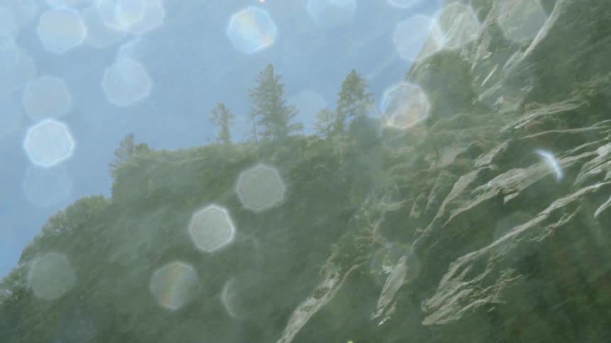 Water is spraying down over this rock cliff