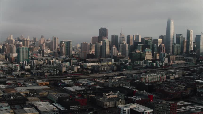 An aerial view of a city with tall buildings