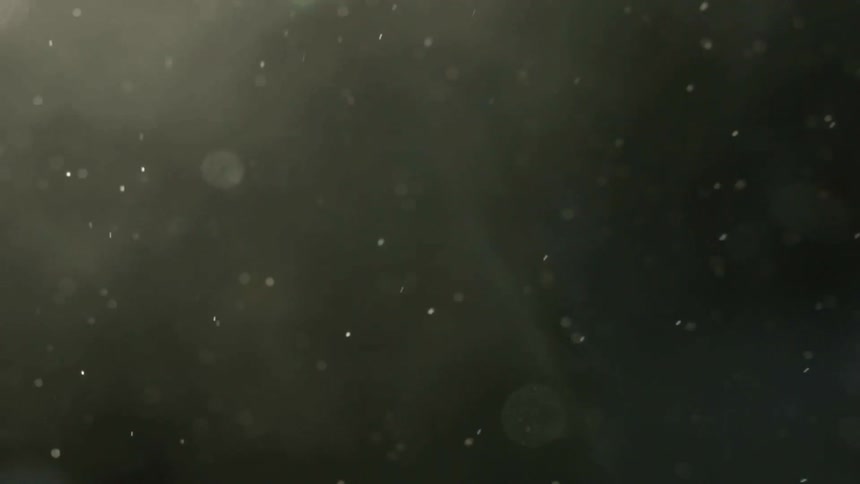 A dark area has smoke and dust flying