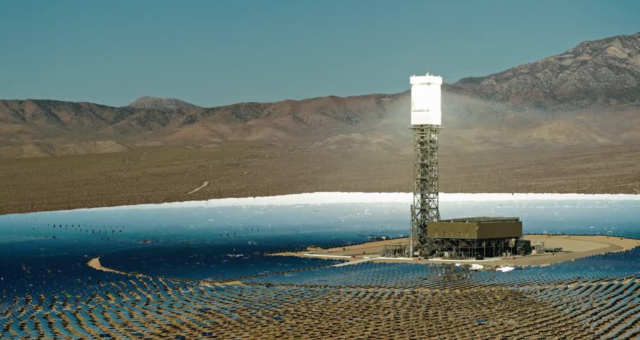 Utility tower on an island with mountains in the distance