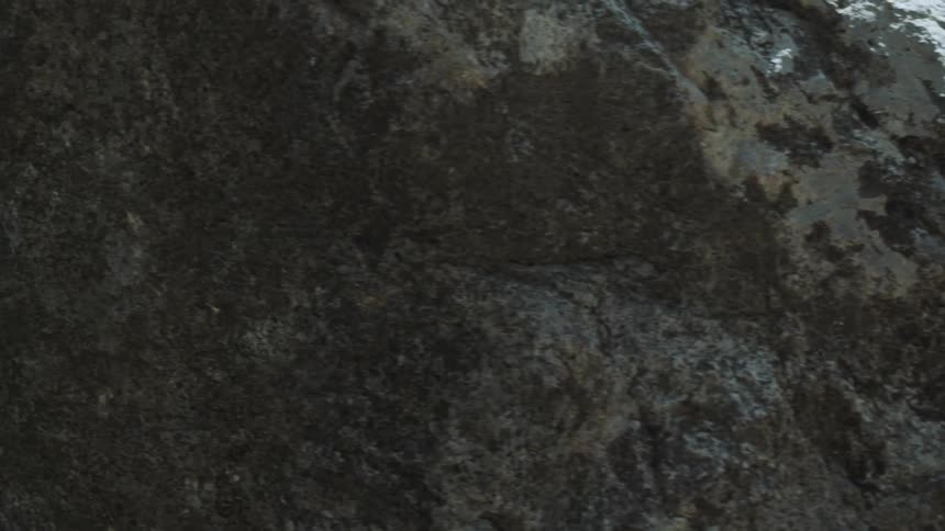 Panning a very large grey rock