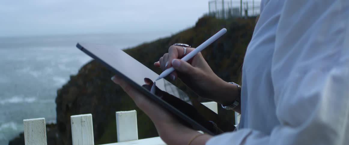 Person drawing on tablet