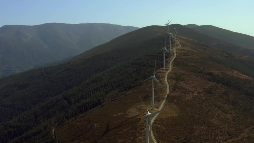 The mountain is covered with windmills