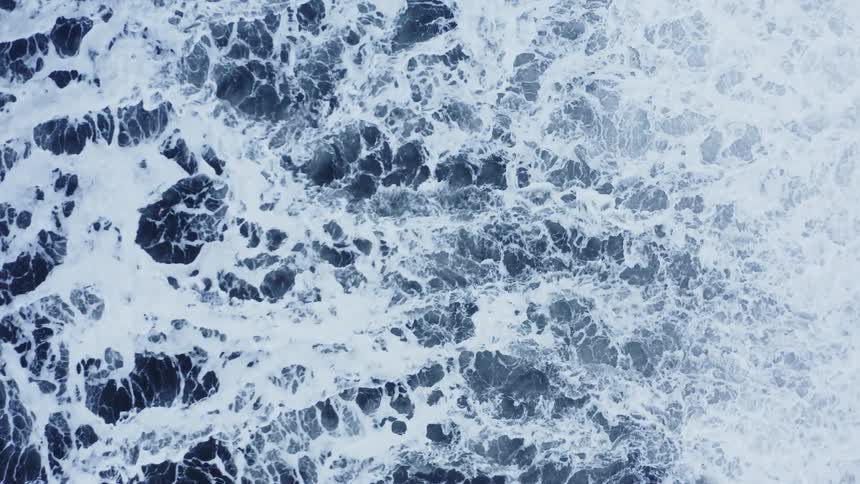 The water below is rough and splashing