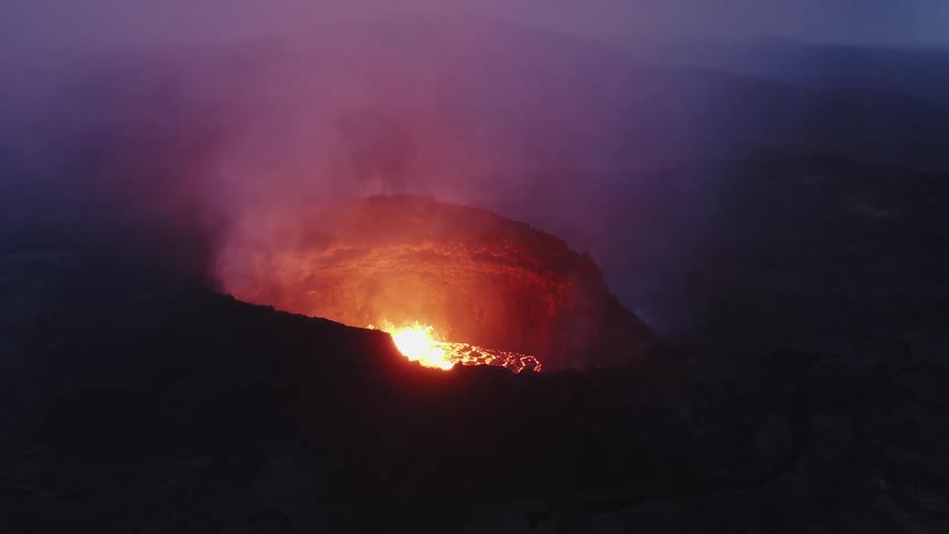 The active volcano is giving off steam