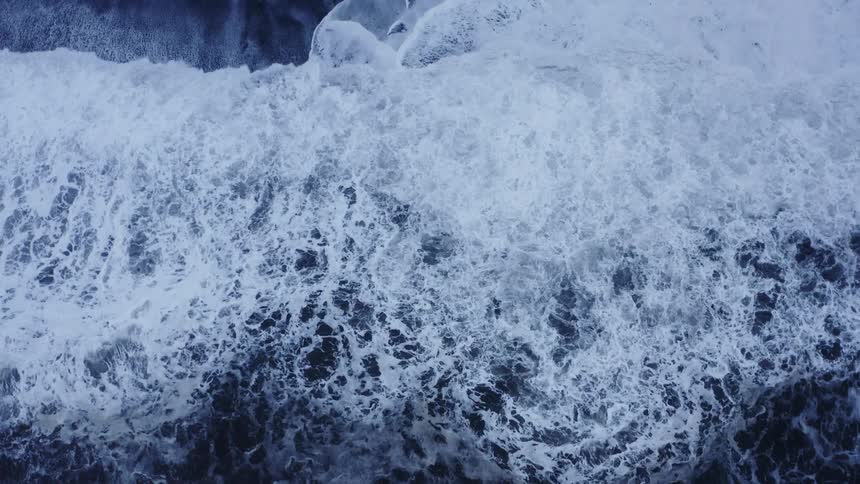 A beach with water and waves