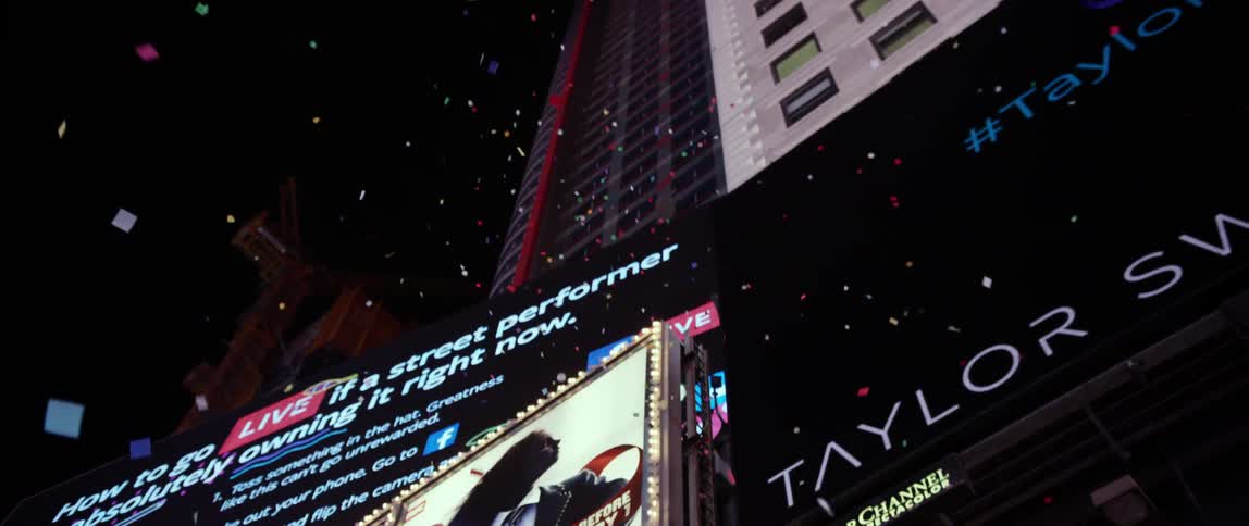 Confetti floats down near a building