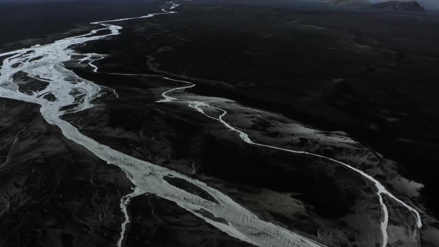 A river flows around a volcano