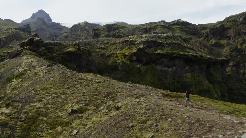 A woman is running on the mountain