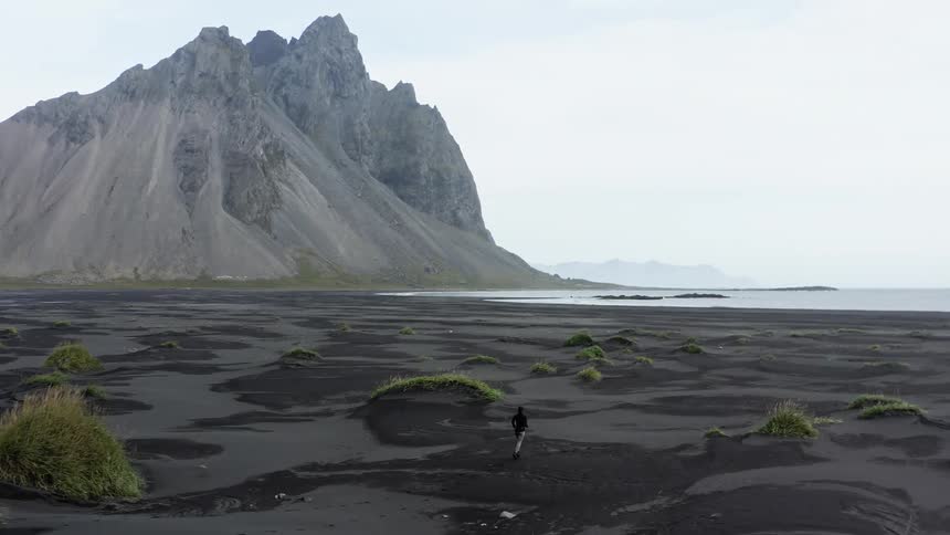 A woman is running on the beach