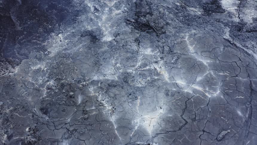 The ground is black with cracks all over