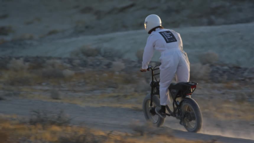 A man riding a dirt bike outdoors