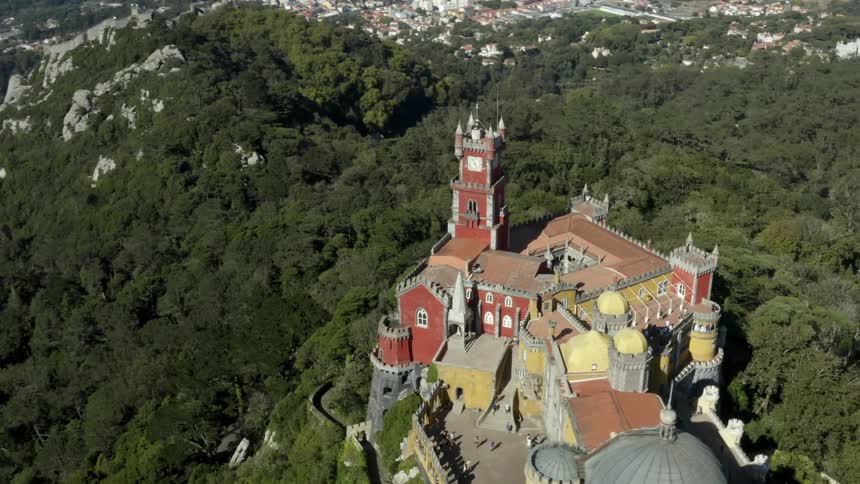 A castle sits on the mountain top by the village