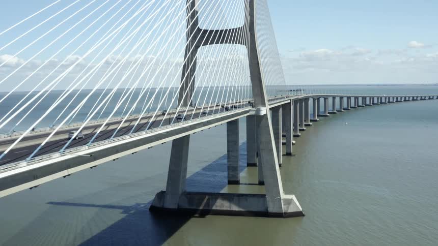 Aerial view of cars crossing cable stayed bridge
