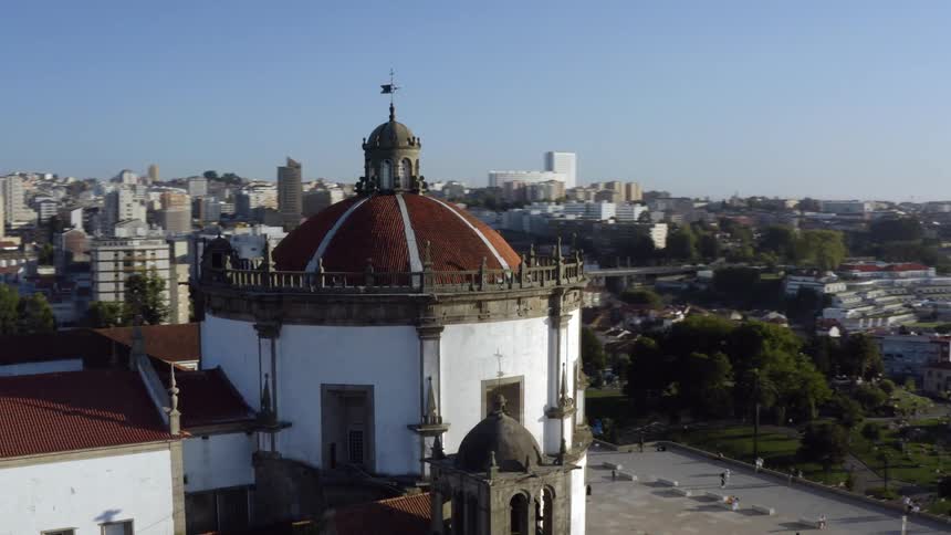 A domed building sits overlooking a large urban area
