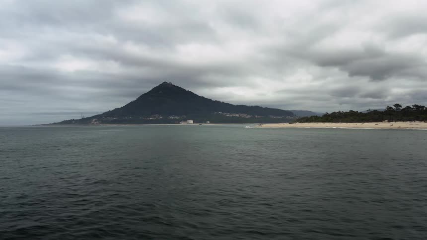 There are heavy clouds over the beach