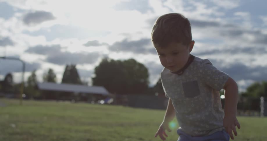 A boy shoots a foam rocket into the air