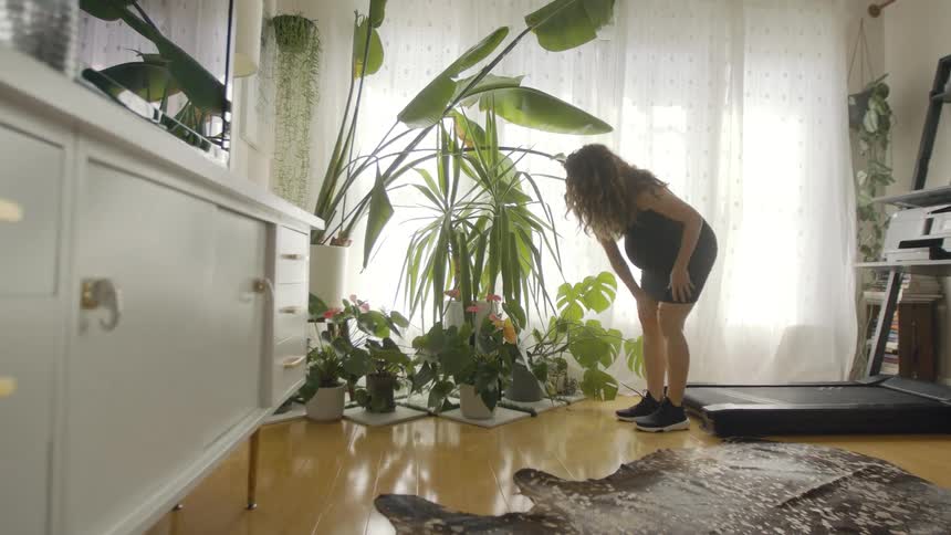 Woman standing on treadmill