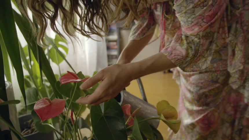 Female watering plants