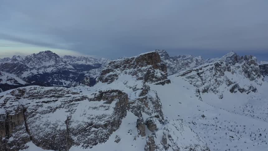 The mountain range is covered with heavy snow