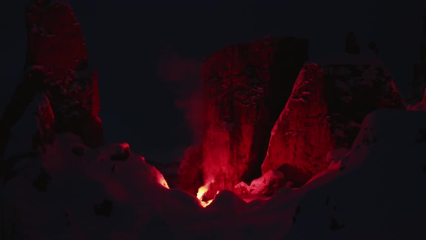 A cave with fire and smoke