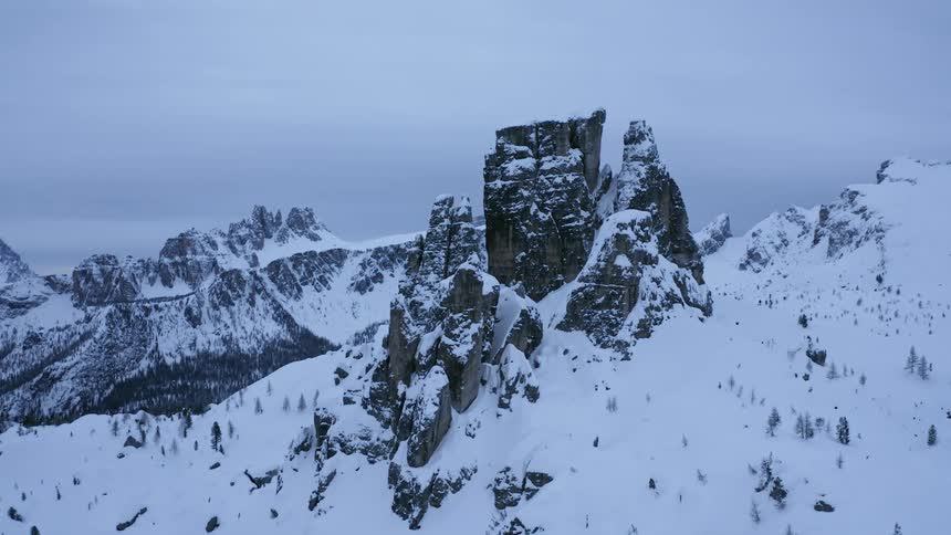 A plateau sits between sharp mountain peaks