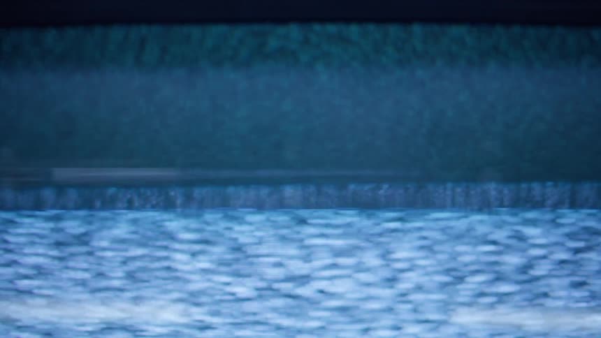 Static fades in and out on a television screen